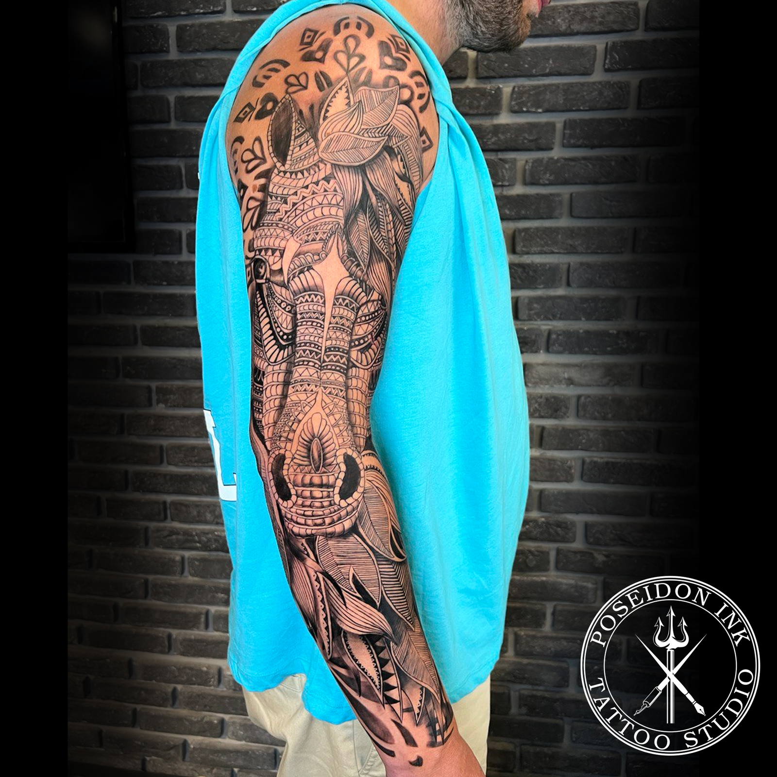 Full sleeve ornamental tattoo of a stylised horse with bridle built entirely from decorative patterns and fine linework